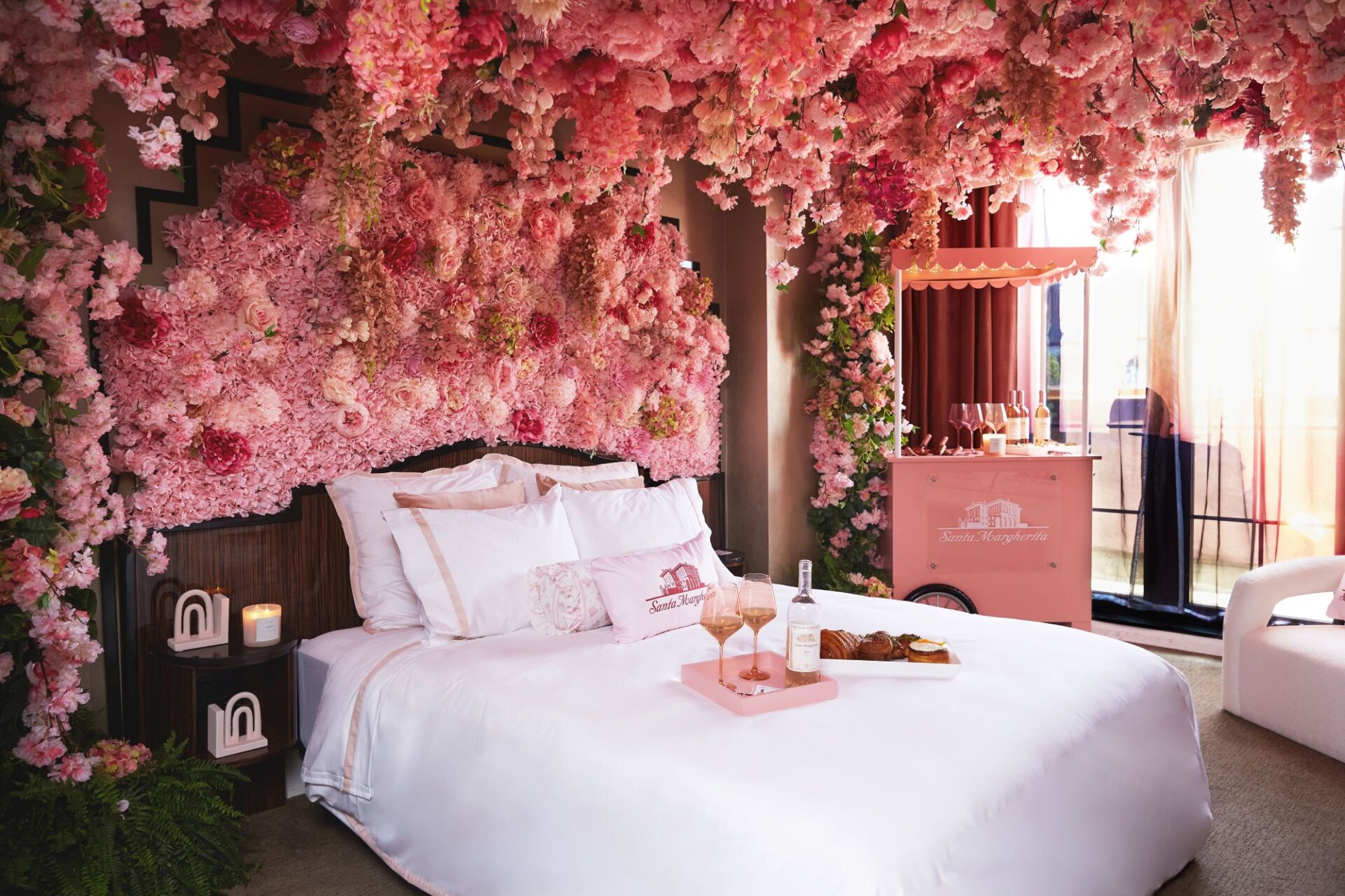 Guest room at Walker Hotel Greenwich Village transformed with pink flowers and rosé for Santa Margherita partnership